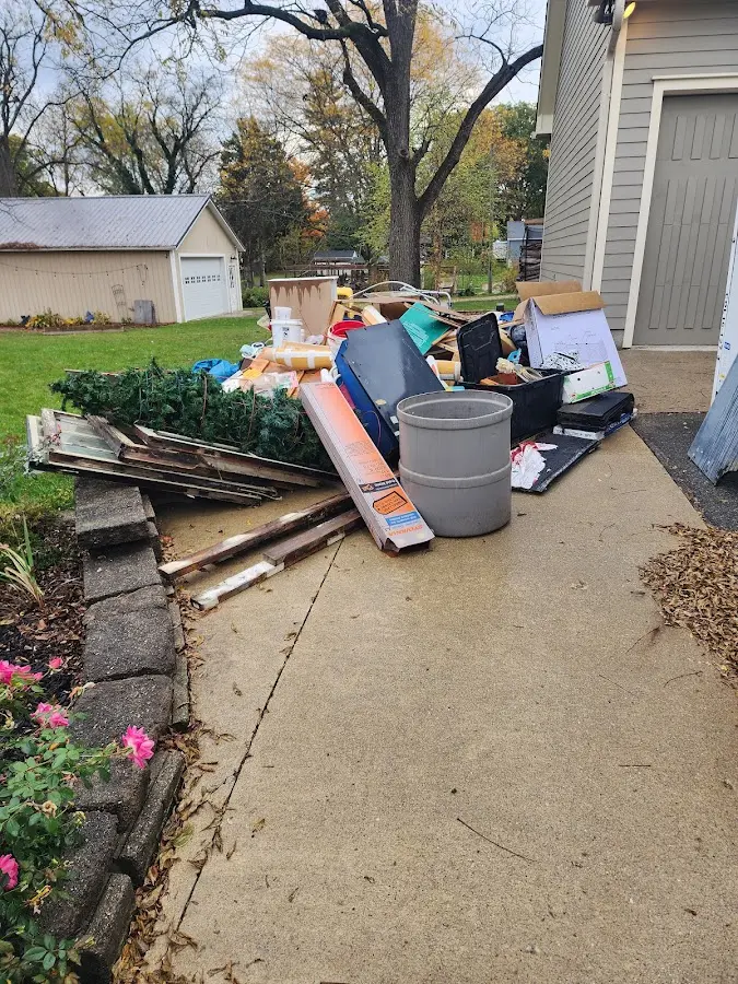 Dumpster being loaded with debris for 30 Yard Dumpster Rental in Warrenton